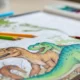 Kolorowanka z pokolorowanymi dinozaurami i kredki